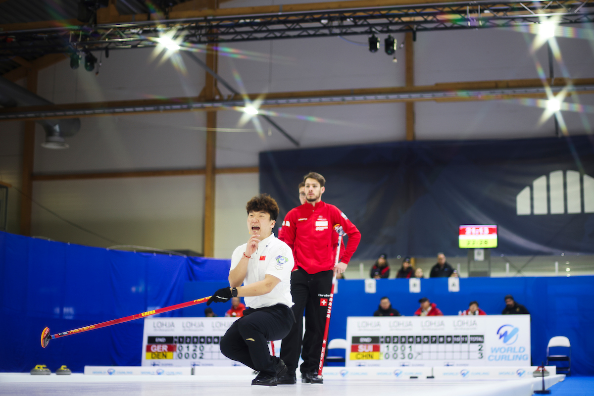 Switzerland versus China © World Curling / Stephen Fisher